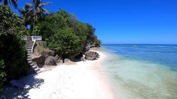 On the beach, white sand, beach towels