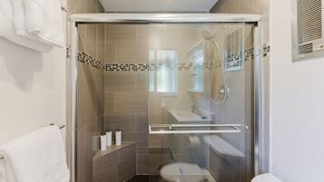 Bathtub, hair dryer, towels, soap