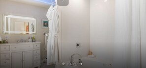 Jetted tub, hair dryer, towels, soap