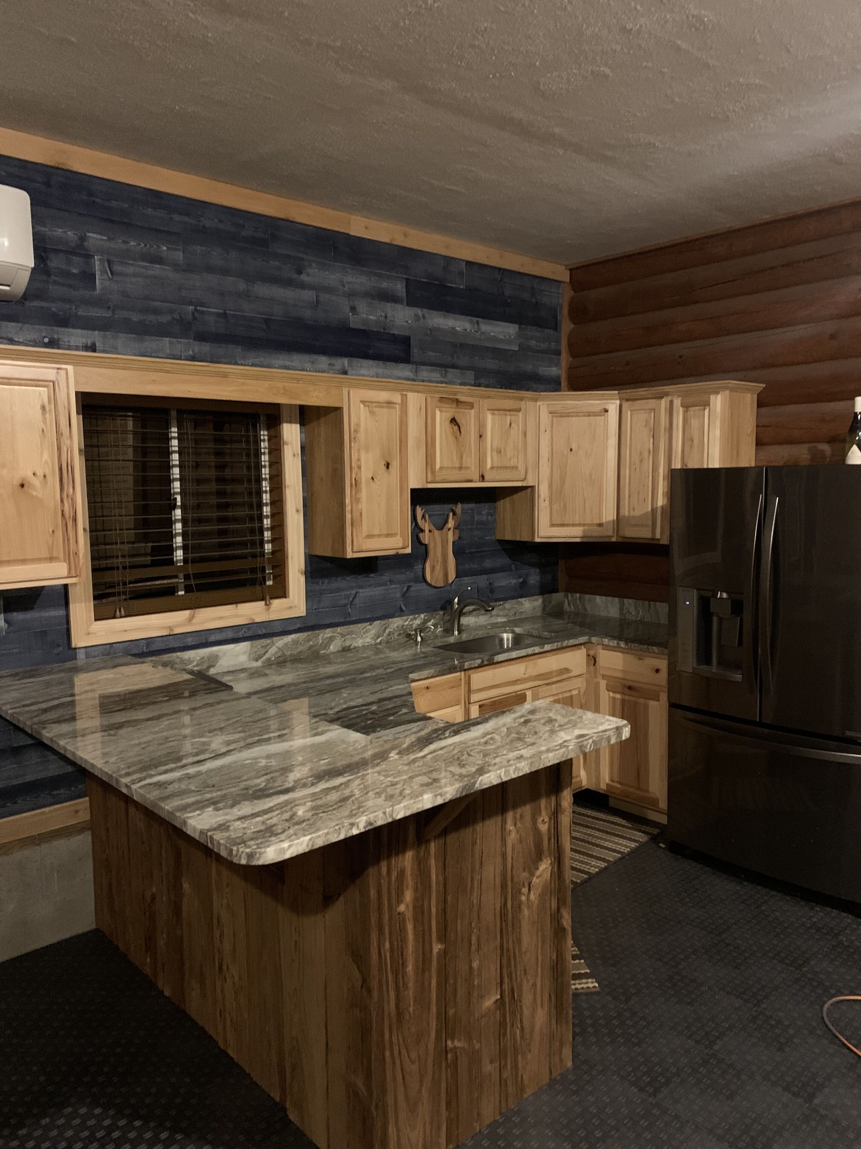 Tall Pines Lodge with private pond and sauna.