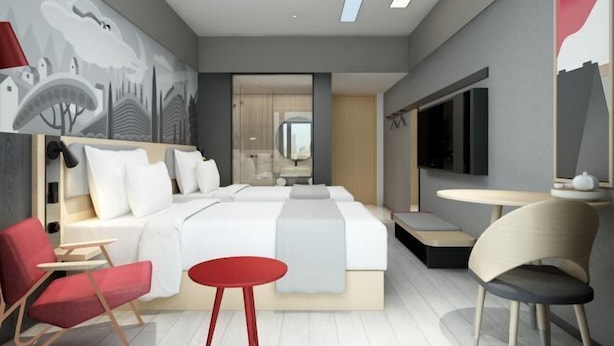 A modern hotel room with a large bed, a desk, a chair, and a TV. - Shankee Hotel (Wujiang Pedestrian Street) (Suzhou)