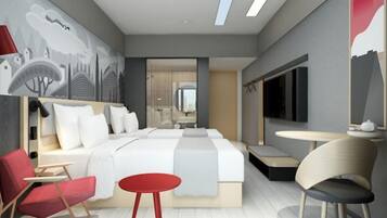 Una habitación de hotel moderna con una cama grande, dos sillas rojas, una mesita redonda y un televisor.
