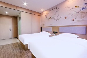 A hotel room with two beds, a large mirror, and a wall with a nature-themed mural. - Shankee Hotel (Wujiang Pedestrian Street) (Suzhou)