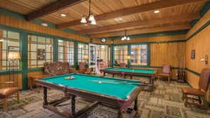 A pool hall with multiple pool tables, wooden walls, and a classic design. - 1BD/Williamsburg at Governor's Green - Lots to do! (Williamsburg)