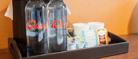 A tray with two bottles labeled "Osage Casino" and various food items including yogurt and packaged snacks.