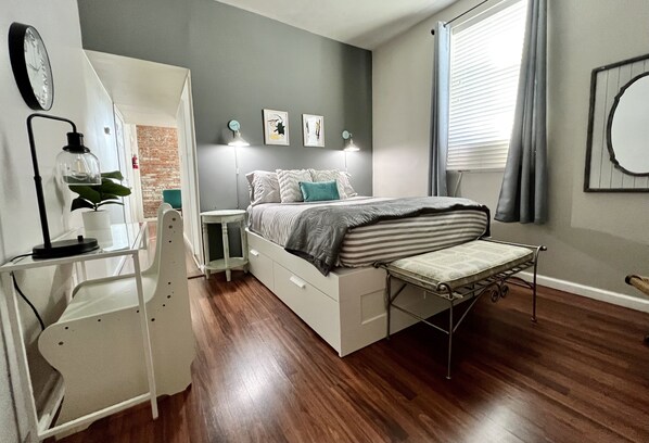 Comfy queen bed with extra linens and storage underneath bed