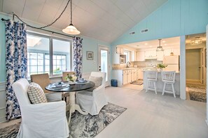 Enjoy meals in the dining area with a round table and comfortable seating.
