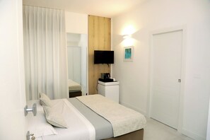 Quarto básico | Roupas de cama premium, Wi-Fi de cortesia, roupa de cama
