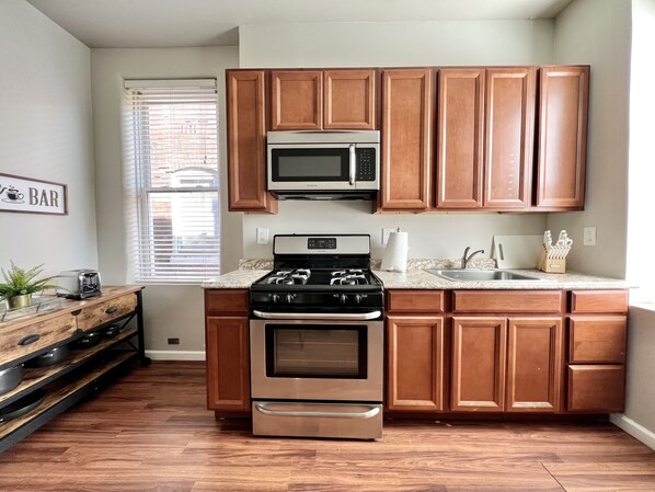Fridge, microwave, stovetop, coffee/tea maker