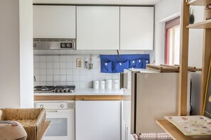 Fridge, oven, dishwasher, dining tables