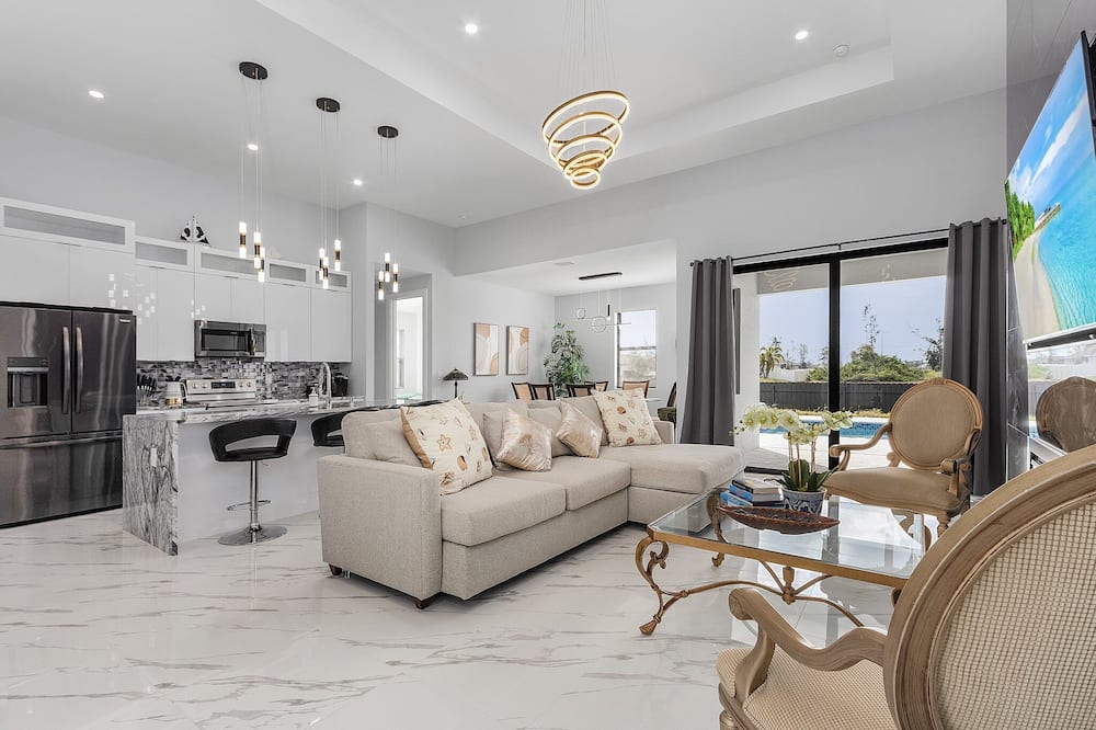 Villa Del Sol Vacation Pool home with outdoor TV and work/office room.