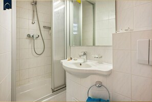 Shower, hair dryer, towels