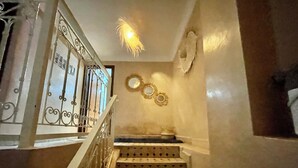 A staircase with a patterned floor and a metal railing. - Au Riad Des Deux Patios - Marrakech  (Marrakech)