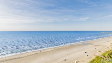 On the beach, sun-loungers