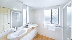 Combined shower/bathtub, hair dryer, towels, soap
