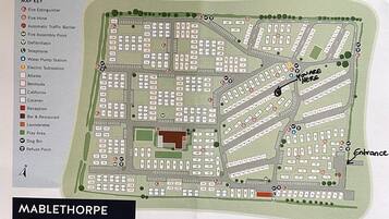 A map of Mablethorpe Caravan & Chalet Park with designated parking areas, a reception, and a play area.