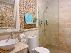Shower, hair dryer, towels, soap