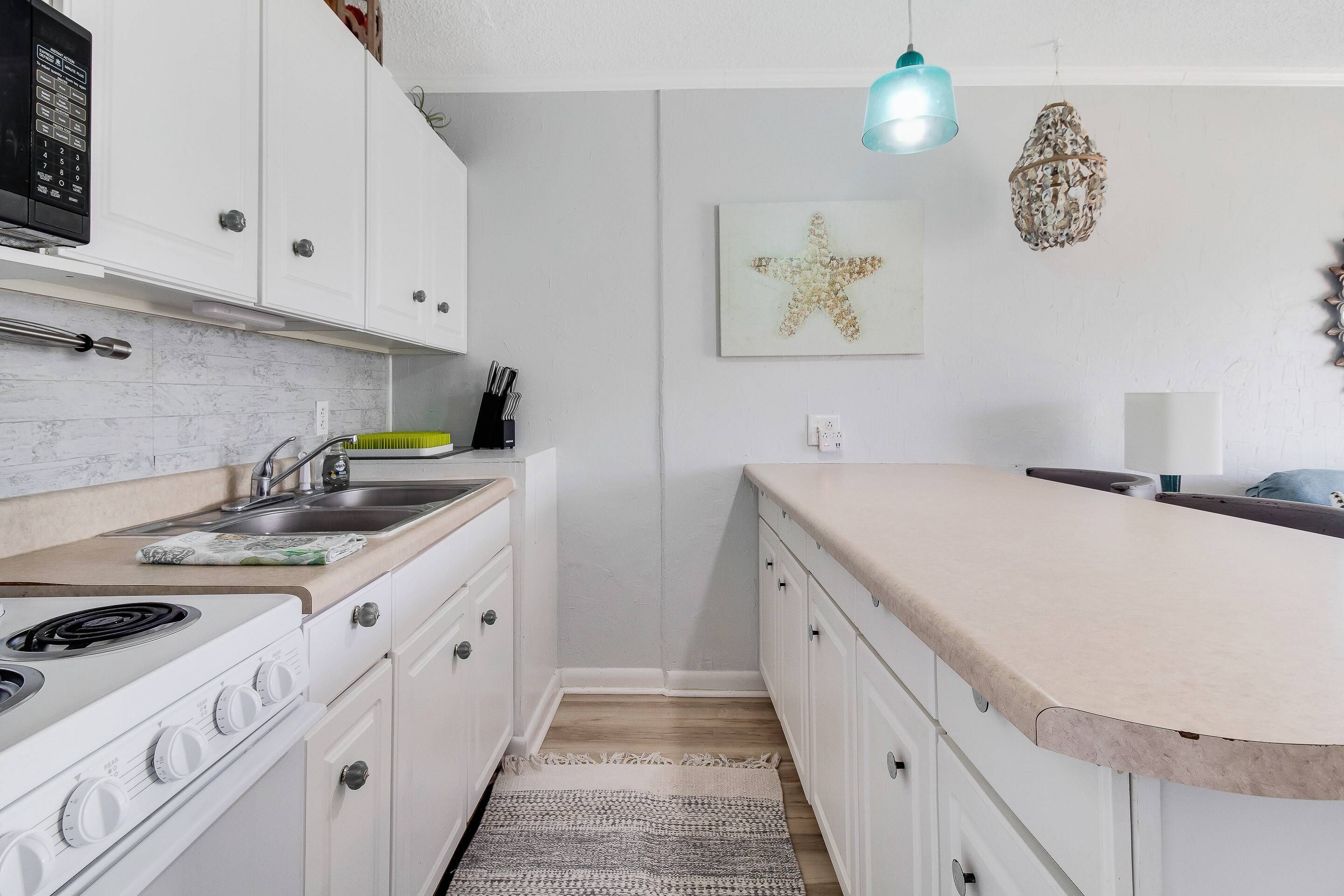 Hear the Ocean Waves from this Wonderful 2 Bedroom condo With Convenient Beach Access &amp; Restaurants