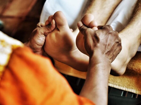 A close-up of hands holding each other, suggesting a sense of comfort or support. - Ayurveda Spring of life Resort (Piliyandala)
