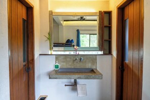 Deluxe Triple Room | Bathroom | Rainfall showerhead, bidet, towels, soap - Island Lyfe Adventures (El Nido)
