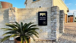A stone building with a sign reading "Tulka House." - The Loft at Tulka House. The Seafood capital of South Australia. (Tulka)