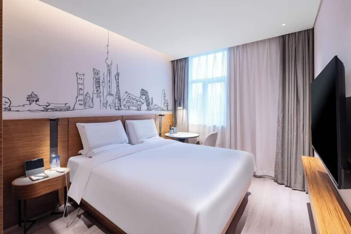 Down comforters, free minibar, in-room safe, desk