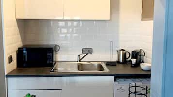 Fridge, microwave, stovetop, coffee/tea maker