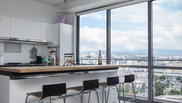 Deluxe Apartment | Private kitchen | Full-size fridge, oven, dishwasher, coffee/tea maker