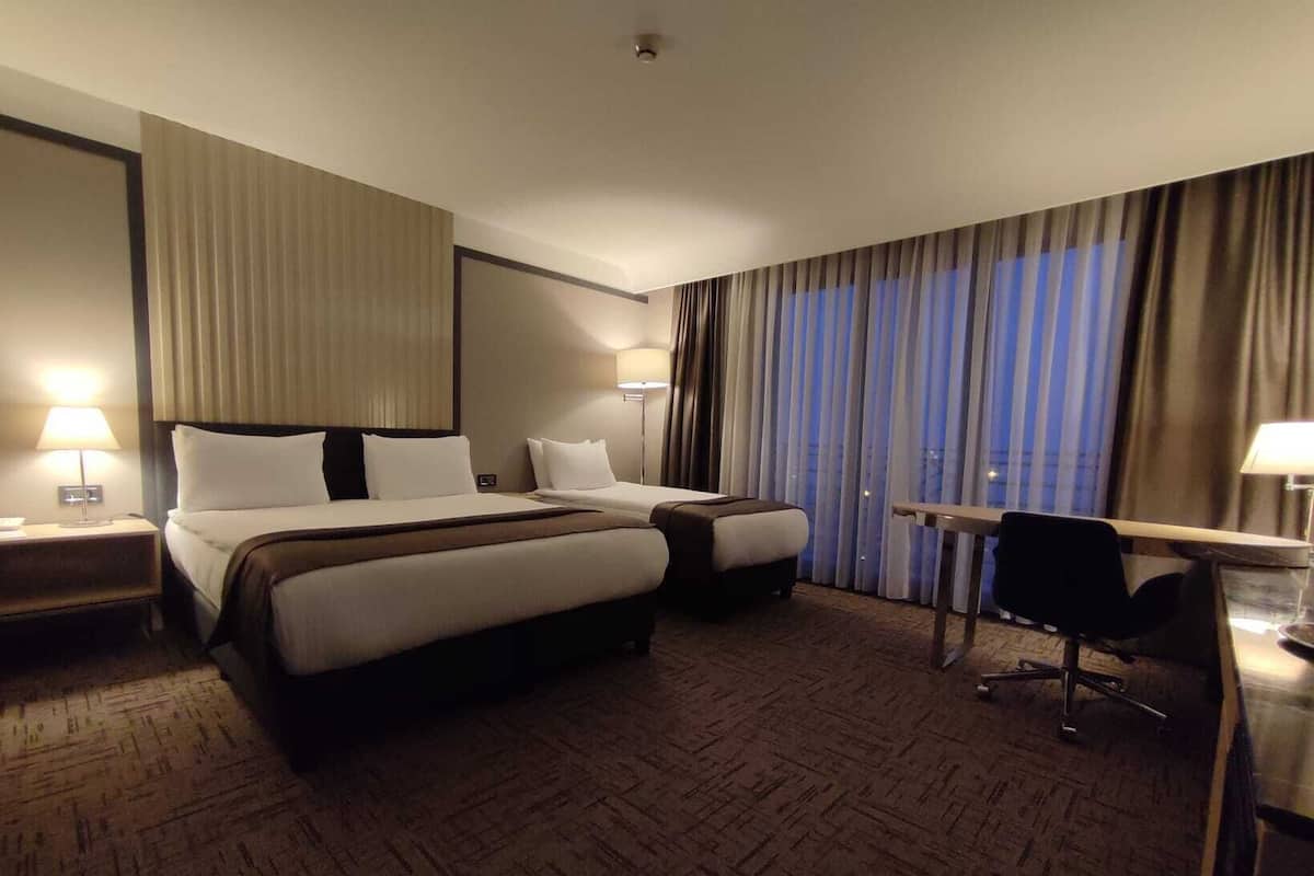 Standard Triple Room, Sea View | Premium bedding, down comforters, minibar, in-room safe