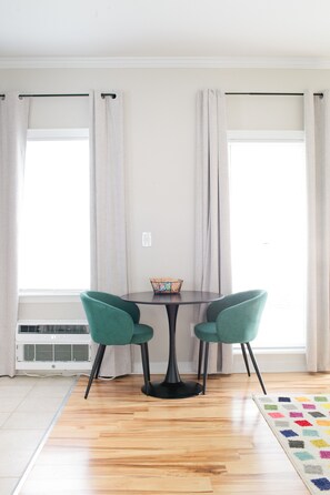 Relax in this inviting room with a central table and two comfortable chairs.