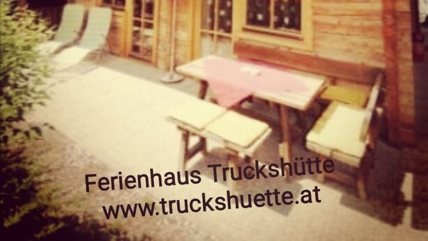 A wooden building with a balcony and outdoor seating. - Truckshutte Holiday Home (Mayrhofen)