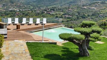 Seasonal outdoor pool, open 9:00 AM to 7:30 PM, pool umbrellas