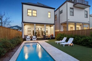 A heated pool, sun loungers