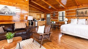A log cabin interior with a living room, a dining area, and a kitchen. - Amazing Mt. LeConte Views/Gatlinburg (Gatlinburg)