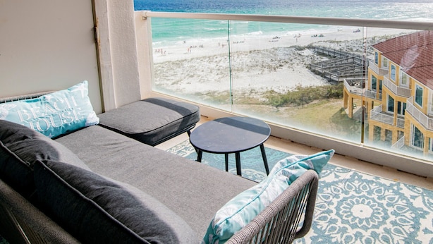 A balcony with a view of the beach and ocean. - Regency Towers #708 West | Gulf Views, Pool! (Pensacola Beach)