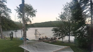 A hammock, a dock, and a lake.