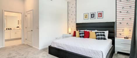 Bright Themed Bedroom with Plush Bed and Ensuite Bathroom
