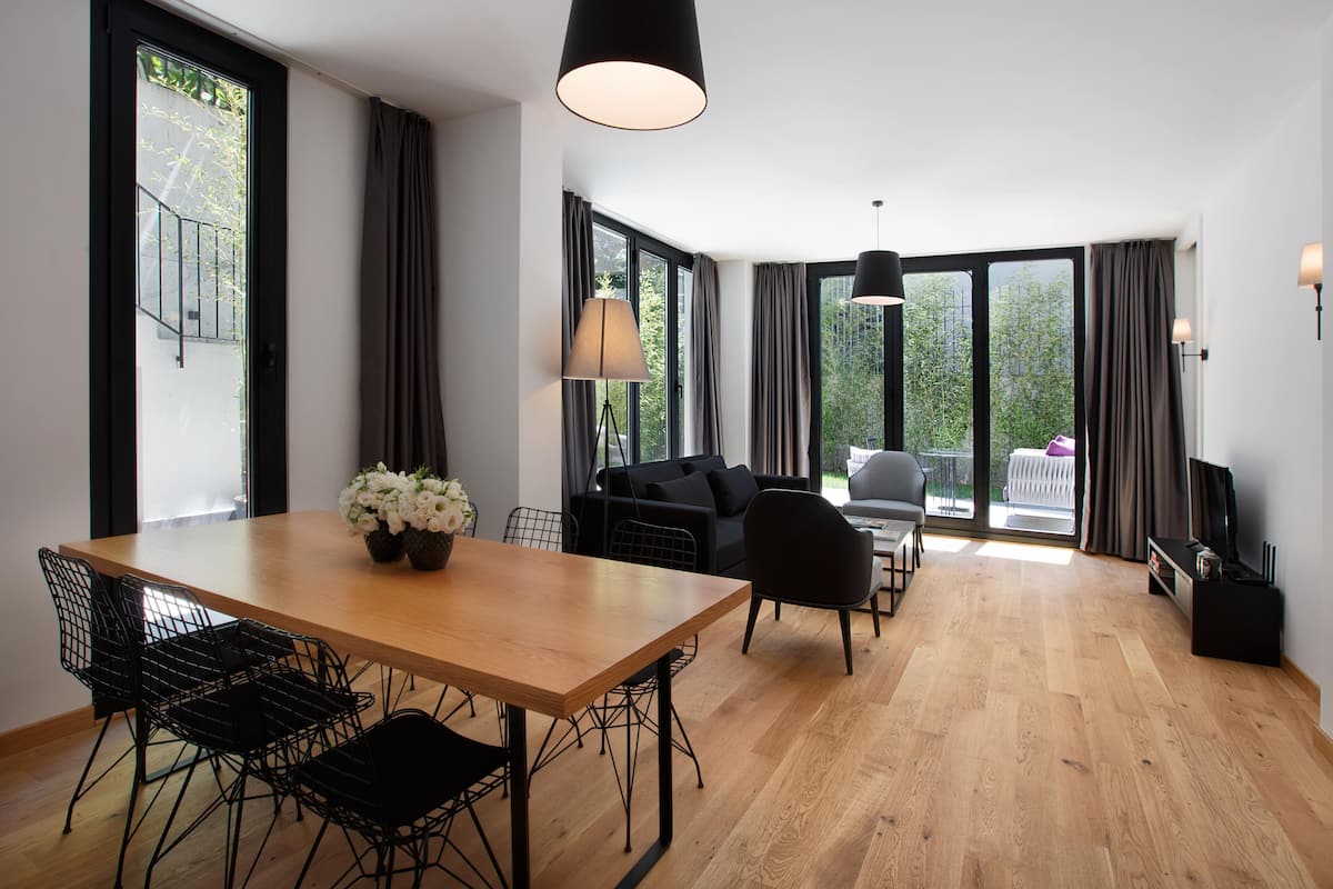 Deluxe Apartment, 1 Bedroom, Non Smoking, Garden View | Living area | 43-inch Smart TV with satellite channels, TV, heated floors
