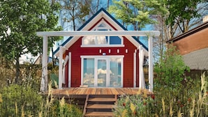 A red house with a white porch and wooden steps leading to a glass door. - Scandinavian holiday home right by the lake (Klepnica)