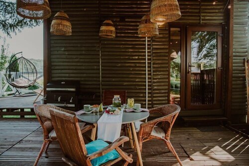 Holiday home with a terrace, right by the lake