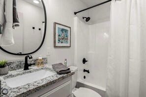 Bathtub, hair dryer, towels, soap