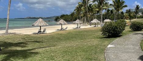 On the beach, sun loungers, beach towels