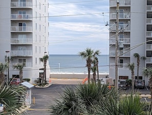 Stunning beachfront homes with balconies overlooking the ocean.