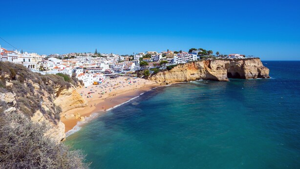 A coastal town with a beach, buildings, and cliffs. - CARVOEIRO TERRACE by HOMING (Carvoeiro)