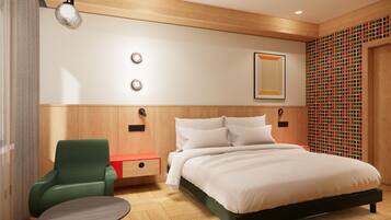 A modern hotel room with a wooden headboard, a green armchair, a small table, and a bed with white bedding.