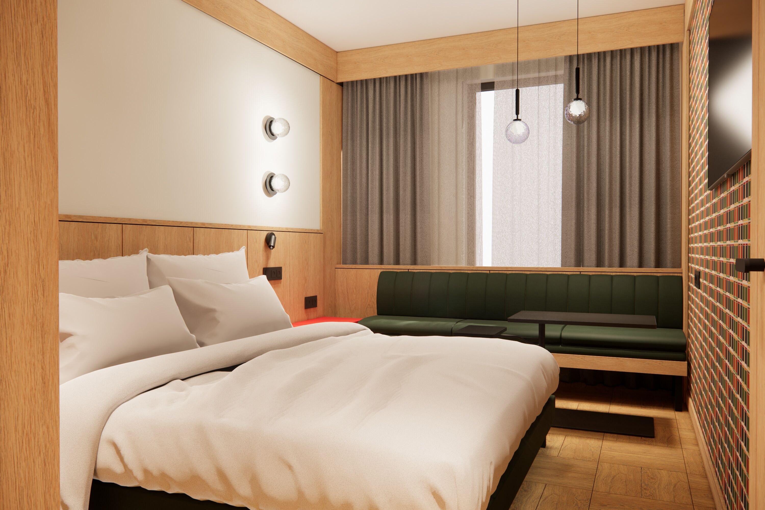 Moderni hotellihuone, jossa on suuri sänky, vihreä sohva ja seinään integroitu kirjahylly.