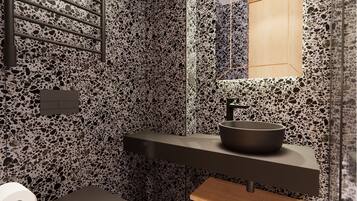 A modern bathroom with a terrazzo floor, a black sink, and a wooden vanity.