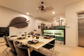 A modern kitchen with a dining area. - Villa Sabine private pool 4br seaview (Rawai)