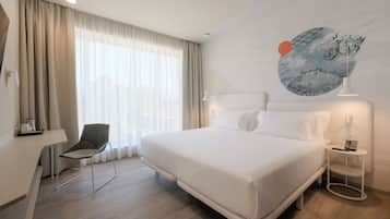 Ropa de cama de alta calidad, colchones con pillow-top y minibar