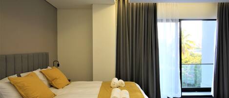 Deluxe Studio | In-room safe, desk, laptop workspace, blackout drapes